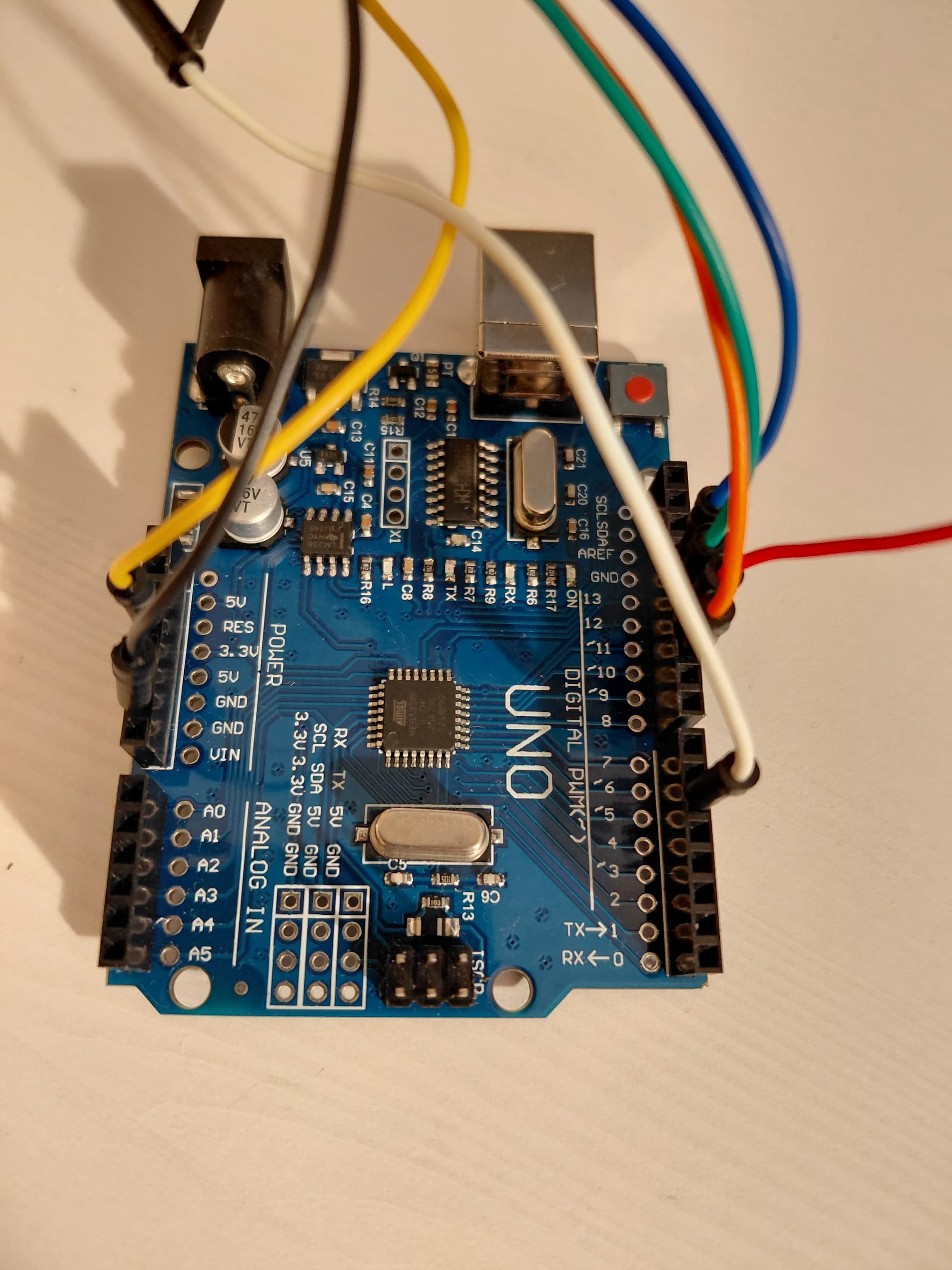 photograph close up of an Arduino Uno microcontroller